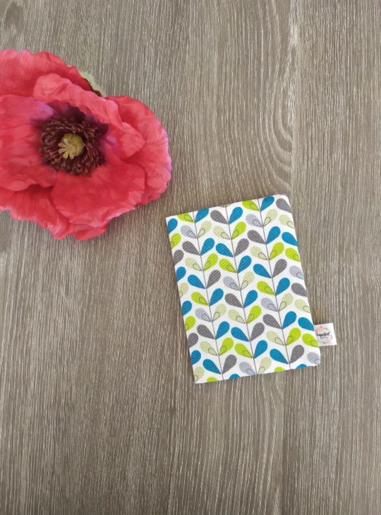 CARNET A6-FEUILLE TURQUOISE-FOND BLANC-1